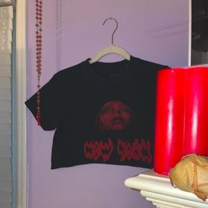 A women cropped Black New York shirt with red lettering.